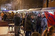 Sfeer ondanks de regen op Heusdense kerstmarkt